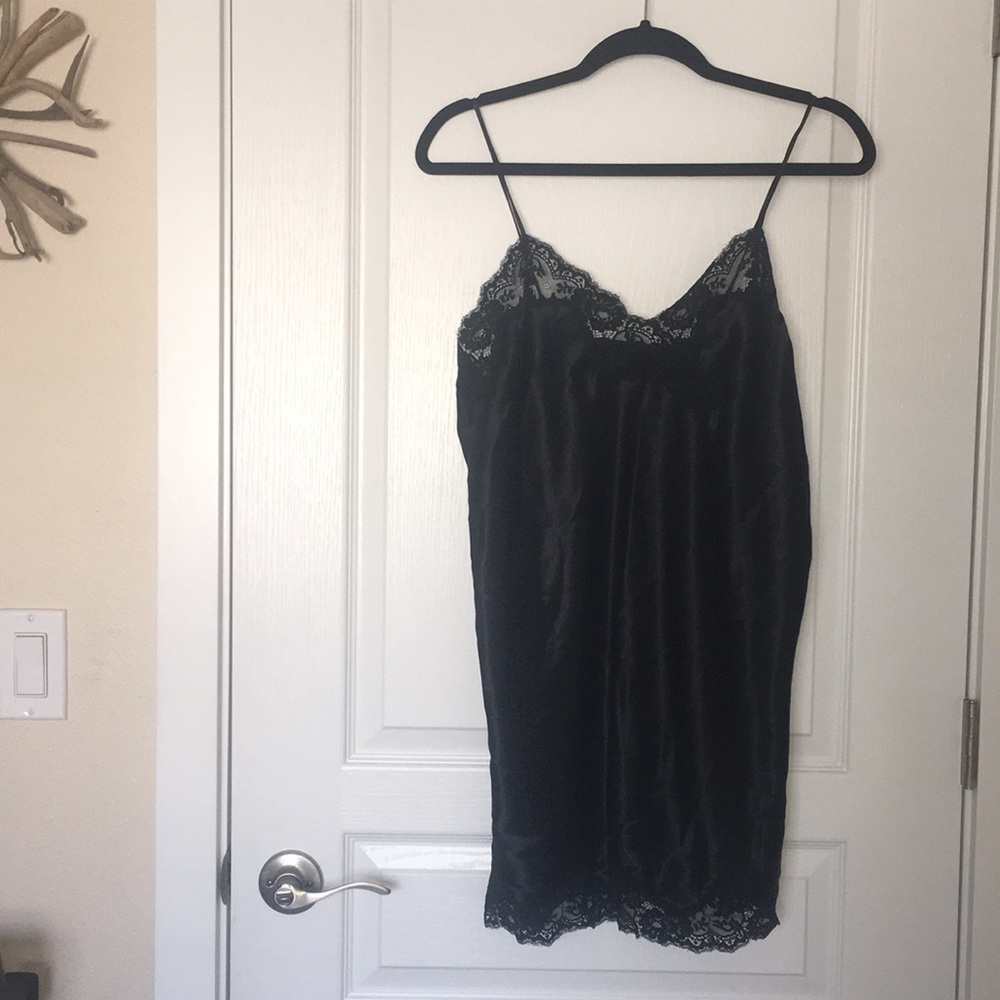 Black slip dress with lace neck line.